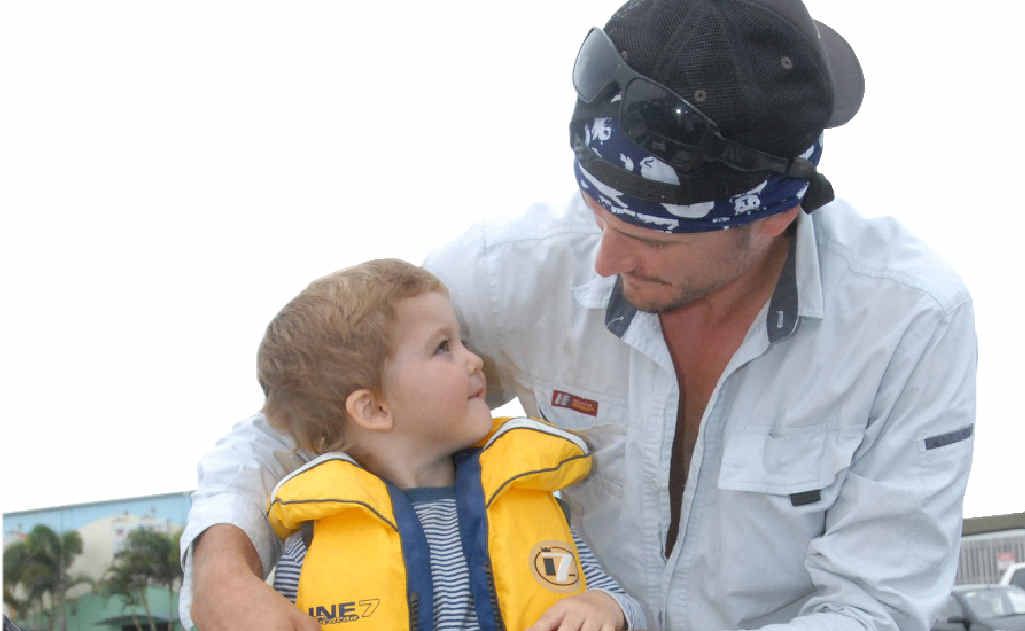 Mackay angler Rick Connolly ensures his son, Jack, is ready to go fishing. Mackay angler Rick Connolly ensures his son, Jack, is ready to go fishing.